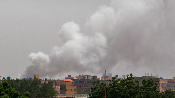 Smoke billows behind buildings from a reported fire in Khartoum