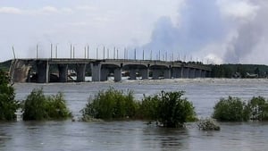 This general view shows a partially flooded area near The Antonovskiy Bridge (REAR) on the outskirts of Kherson, following the dam damage