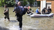 Ukrainians abandoned inundated homes yesterday as floods crested across the south after the destruction of the Novo Kakhovka dam