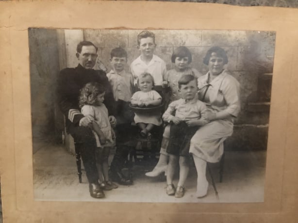 A 1930s sepia photograph of a family group