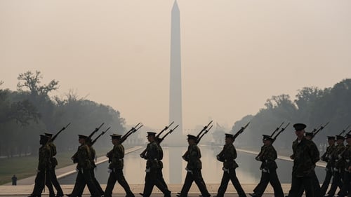 Soldiers of the US Marine Corps shrouded in smoke from Canada wildfires in Washington, DC