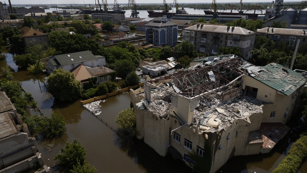 A building damaged by shelling is seen in flood-hit Kherson