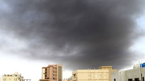 Black smoke billows amid ongoing fighting in the capital Khartoum