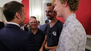 Henri (2R), the 'backback hero', meets Emmanuel Macron in Annecy