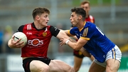 Down's Odhran Murdock in possession against Longfrod's Joe Hagan