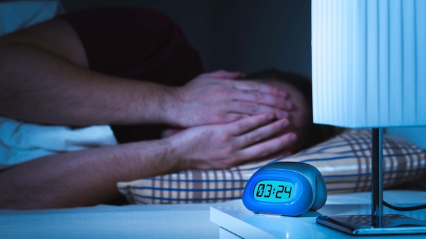 man struggling to sleep