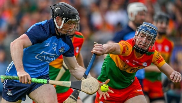 Cian O'Sullivan is challenged by Carlow's Diarmuid Byrne