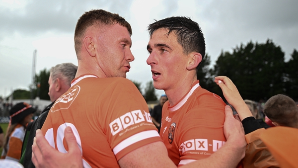 Ross McQuillan and Rory Grugan celebrate a victory which sends Armagh to the last eight