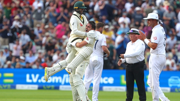 Pat Cummins and Nathan Lyon celebrate as Australia celebrate a thrilling Test match win in Edgebaston