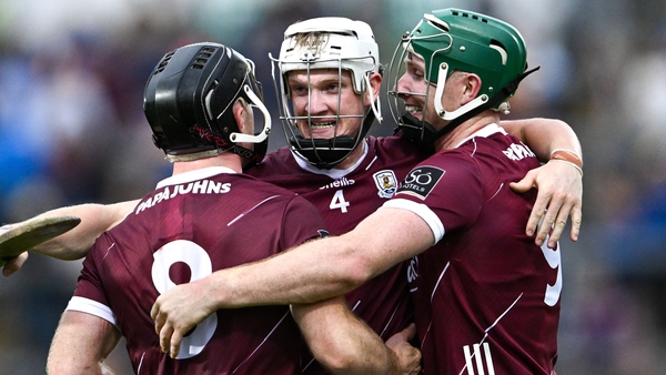 Seán Linnane, Darren Morrissey and Cathal Mannion celebrate after the final whistle