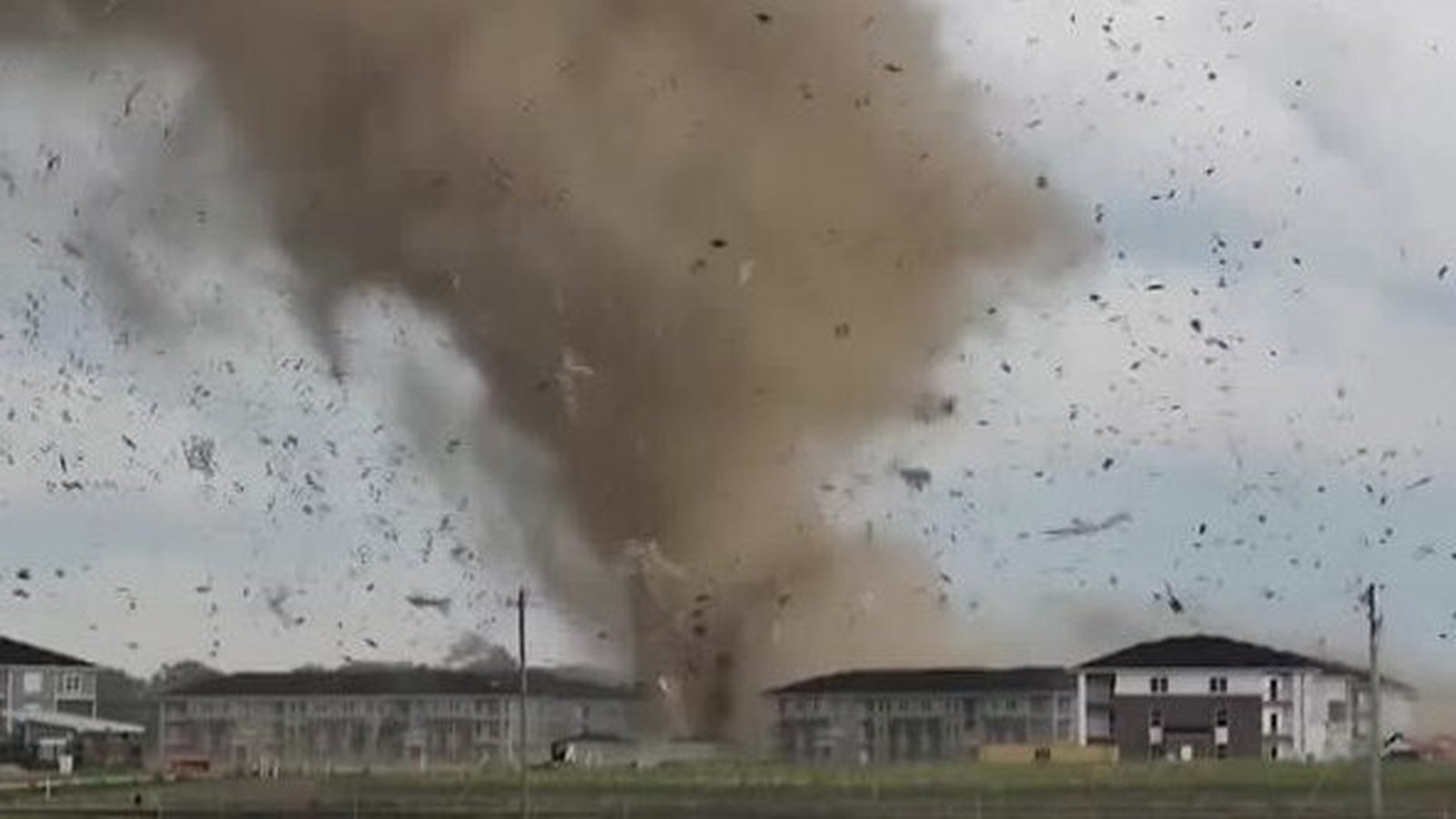 Watch Tornado sends debris flying as it hits Indiana