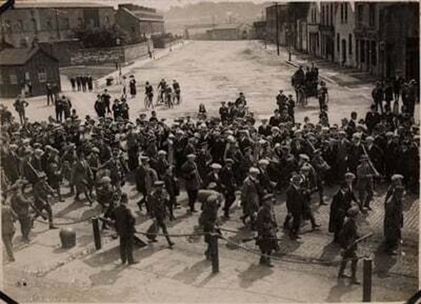 Century Ireland 260 - Republican prisoners captured during the attack on Passage West being marched to the Cork Gaol for detention in 1922 Photo: National Library of Ireland, HOGW 12