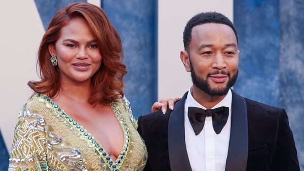 Chrissy Teigen and John Legend pictured at Vanity Fair Oscars Party earlier this year