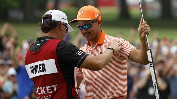 Rickie Fowler celebrates after securing the win on the first play-off hole