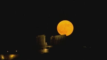 Supermoon rises over ancient Greek temple