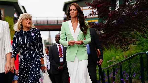 The Princess of Wales has worn a green double-breasted blazer and white pleated skirt to visit SW19.