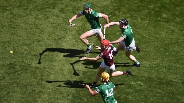 Galway's Tom Monaghan lays off a pass during last year's semi-final with Limerick