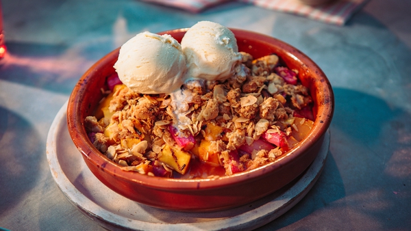 Tart rhubarb and juicy mango are a perfect pairing in this delicate crumble.