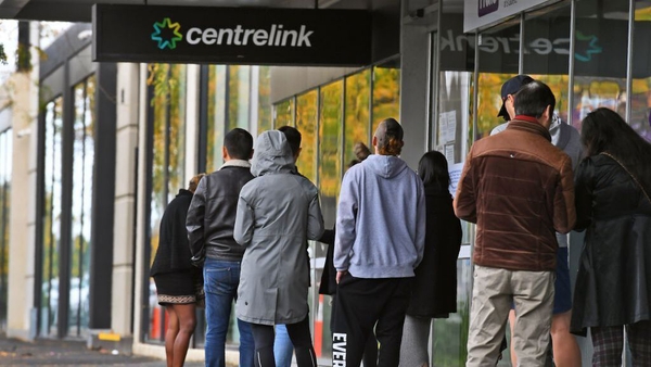 People queueing outside a welfare office in Melbourne (file pic)