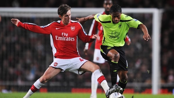 Mark Randall (L) in action against Wigan's Antonio Valencia in 2008