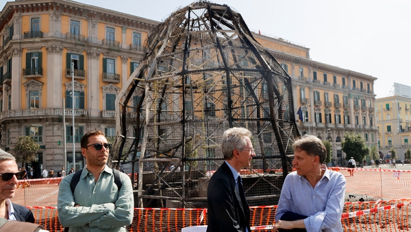 Mayor of Naples Gaetano Manfredi stands next to the charred open-air installation of 'Venus of the Rags'