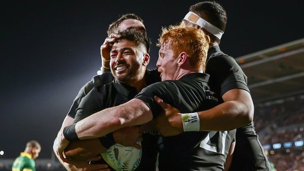 New Zealand's Richie Mo'unga is congratulated by Finlay Christie on scoring his side's fourth try
