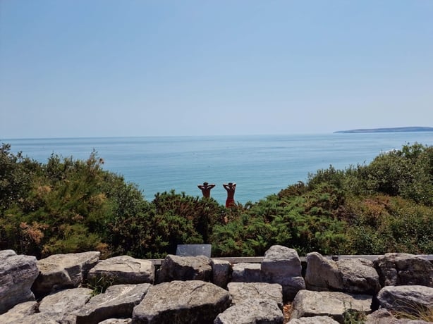 people by the sea