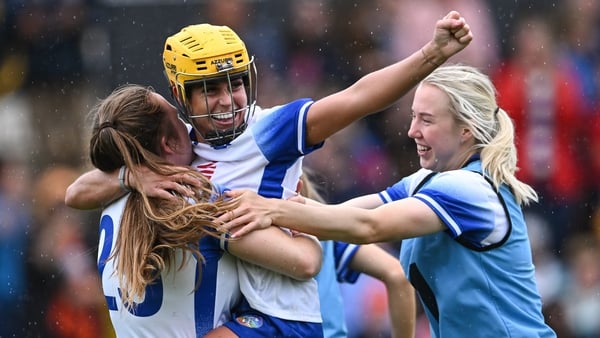Niamh Rockett is held aloft by her team-mate Shauna Fitzgerald as they celebrate after Waterford's victory