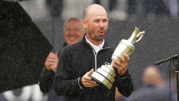 Brian Harman gets his hands on the Claret Jug