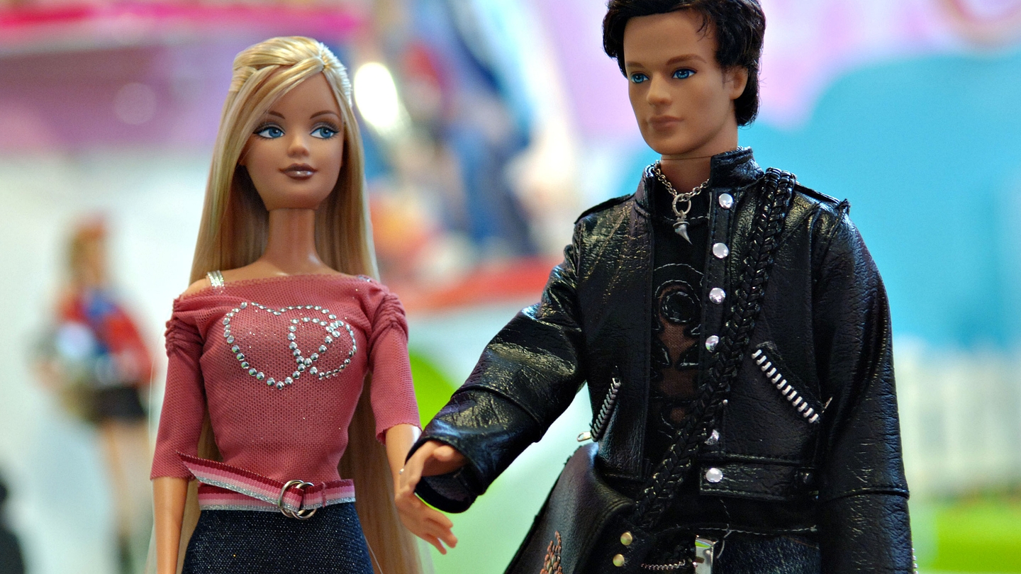 Boy and girl deals barbie