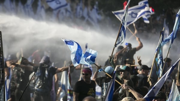 Police officers use water cannon against protesters in Jerusalem