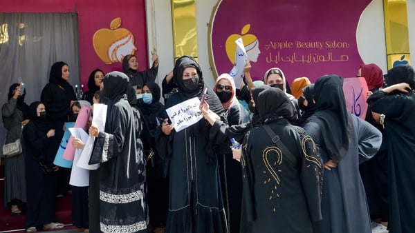 Women protest the order shutting beauty salons