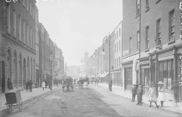 A Robert French photograph of Patrick Street in Limerick in the early years of the 20th century. Town tenants are now seeking the same rights as agricultural tenants and believe that Dáil representation is key to their delivery Photo: National Library of Ireland, L_CAB_04888