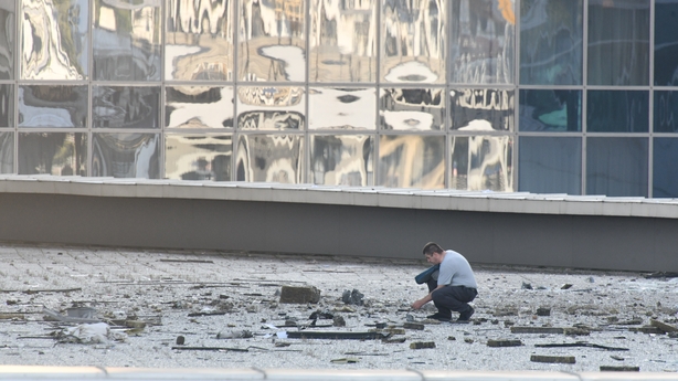 ecurity forces inspect at the scene after a skyscraper attacked by a drone for the second time in two days in Moscow