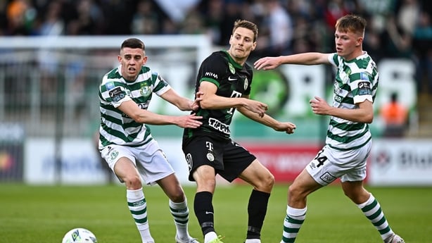 Mats Knoester of Ferencvarosi TC competes for the ball with