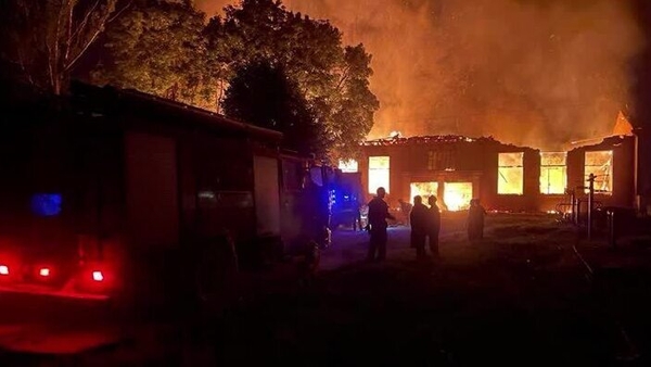 Smoke and flames rise after Ukrainian President Volodymyr Zelensky said a Russian-guided aerial bomb hit a blood transfusion center, in the town of Kupiansk in eastern Kharkiv