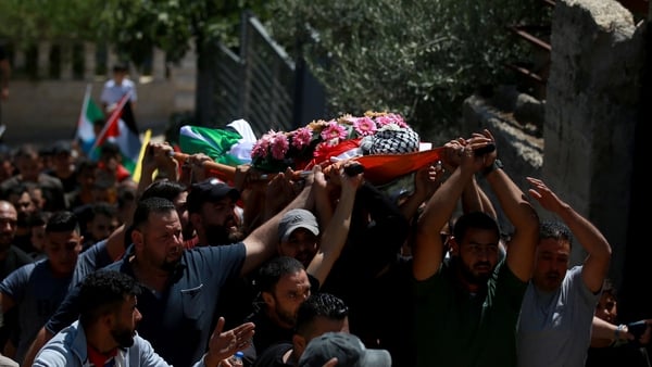 People attend the funeral of 19-year-old Qusai Jamal Maatan, who was killed by Israeli settlers