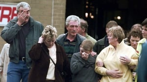 Omagh locals express their grief the day after the blast, in which 29 people were killed