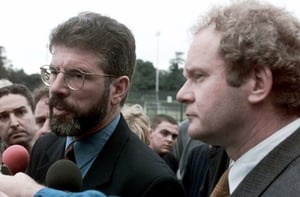 Sinn Féin leaders Gerry Adams and Martin McGuiness visit the site where the bomb exploded