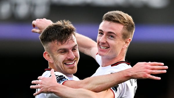 Daniel Kelly of Dundalk (r) celebrates with team-mate Archie Davies finding the net