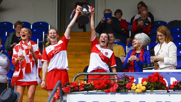 Joint captains, Aoife Ní Chaiside and Aine McAllister lift the Jack McGrath Cup