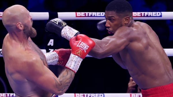 Anthony Joshua throws a punch at Robert Helenius in London