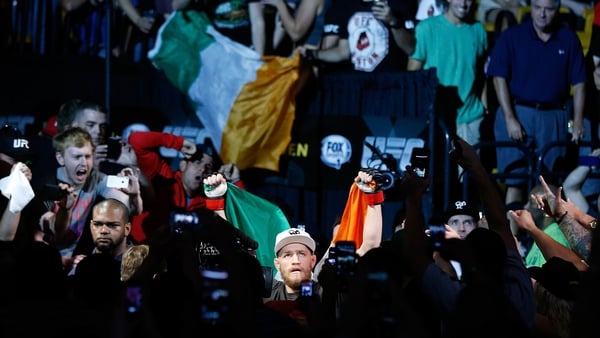 Conor McGregor enters the arena before his UFC featherweight bout against Max Holloway in Boston in 2013