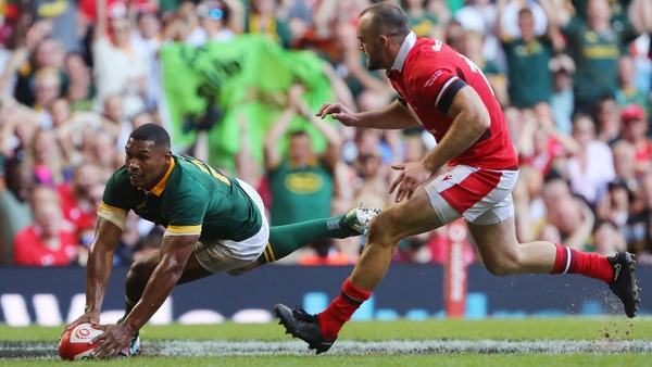 South Africa's Damian Willemse scores a try for the visitors