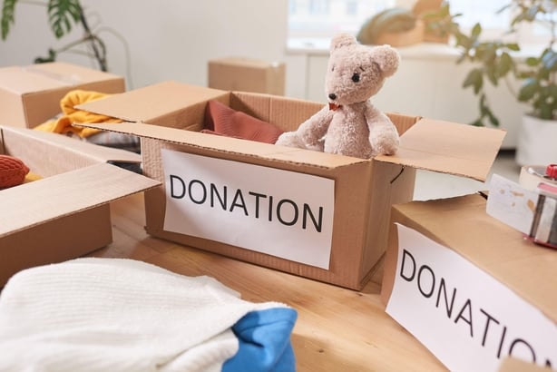 Cardboard box with toys for donation