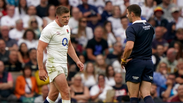 England's Owen Farrell is called over by referee Nika Amashukeli to be shown a yellow card, which was later upgraded to a red by the TMO, for his high tackle on Wales' Taine Basham