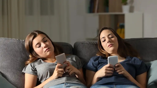 Too much time on the sofa or on their phones could be doing long term damage to teens' hearts (Alamy/PA)