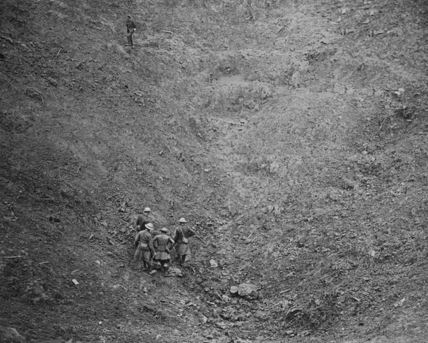 Members of the Royal Engineers examine the crater left after the detonation of the mine at High Wood on the Somme Battlefield. October 1916 (Photo by Official/Mirrorpix/Mirrorpix via Getty Images)