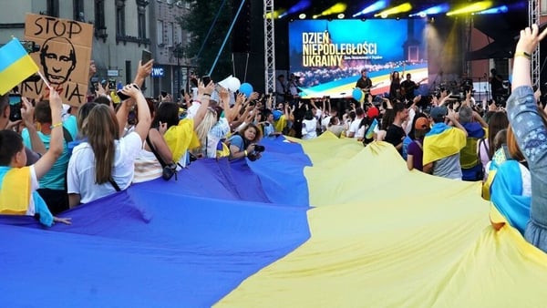 A banner in the Ukrainian national colours was displayed at Zamkowy Square in Warsaw