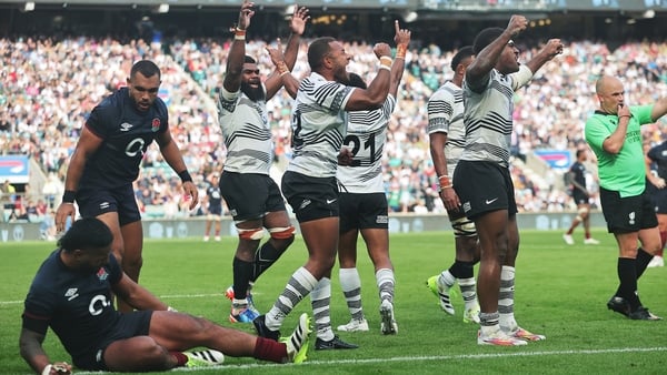 Fiji players celebrate after beating England in August